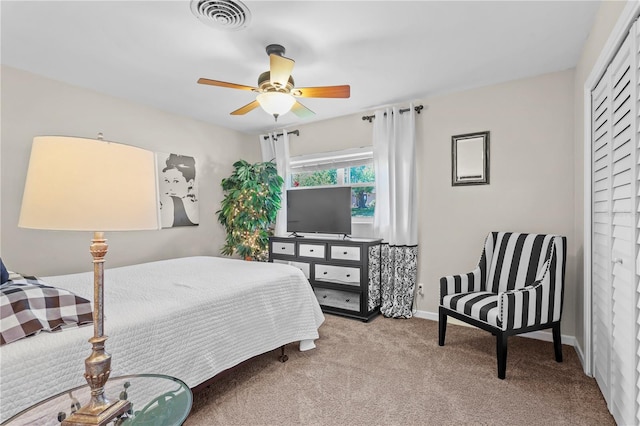 bedroom with light carpet, a closet, and ceiling fan