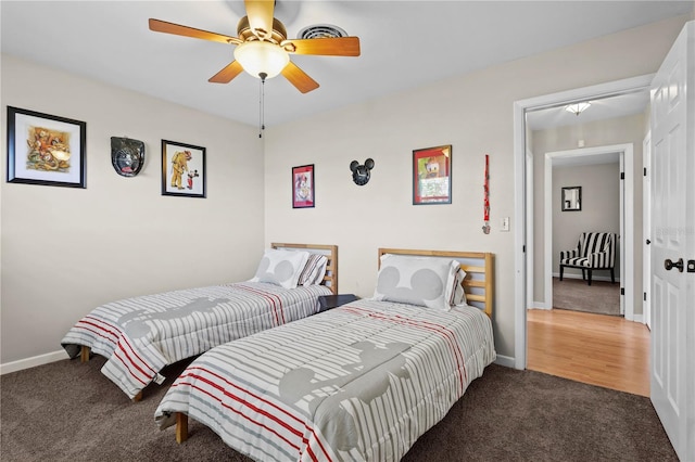 bedroom featuring wood-type flooring and ceiling fan