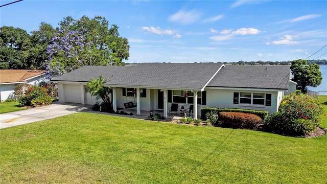 single story home featuring a garage and a front yard