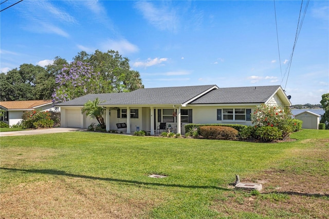 ranch-style home with a front yard and a garage