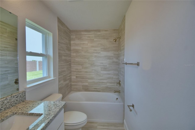 bathroom featuring shower / washtub combination, toilet, baseboards, and vanity
