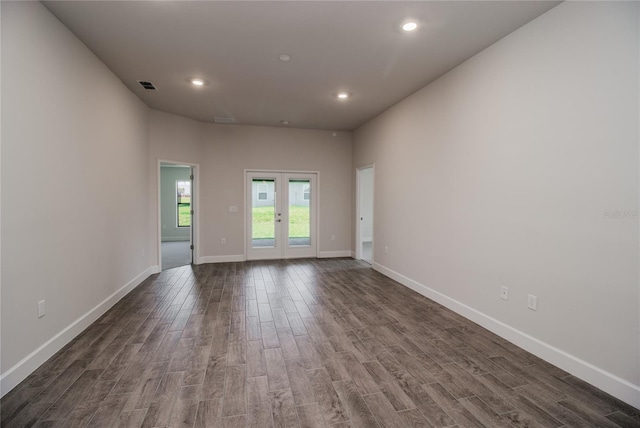 unfurnished room with dark hardwood / wood-style flooring and french doors