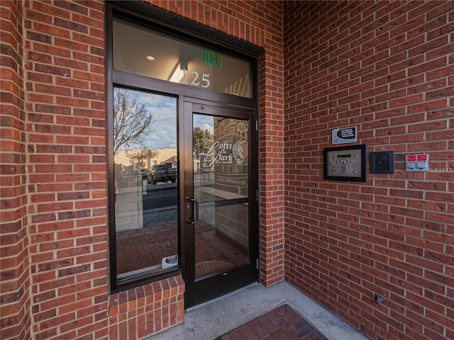 view of exterior entry at dusk