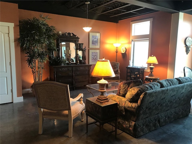 living room featuring concrete flooring