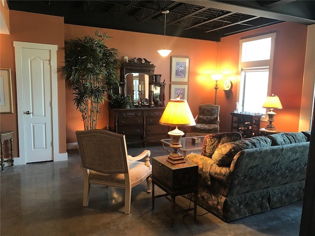 living room featuring concrete flooring