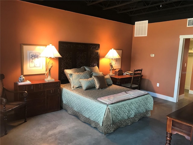 bedroom featuring concrete floors