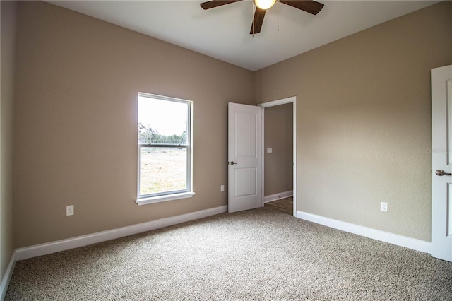 unfurnished room featuring carpet flooring and ceiling fan