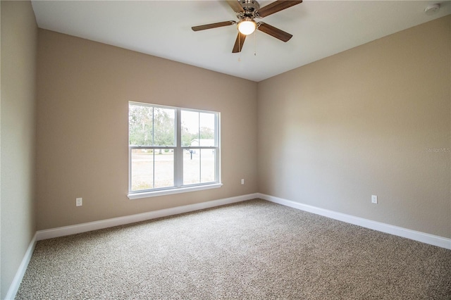 spare room with carpet and ceiling fan