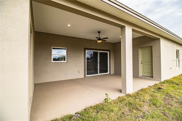 view of patio featuring ceiling fan