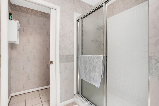 bathroom featuring tile patterned floors and an enclosed shower