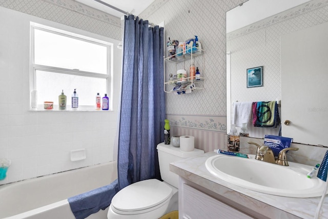 full bathroom featuring vanity, toilet, and shower / bathtub combination with curtain