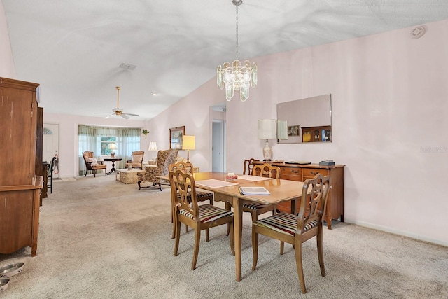 dining area featuring light carpet, a textured ceiling, ceiling fan with notable chandelier, and lofted ceiling