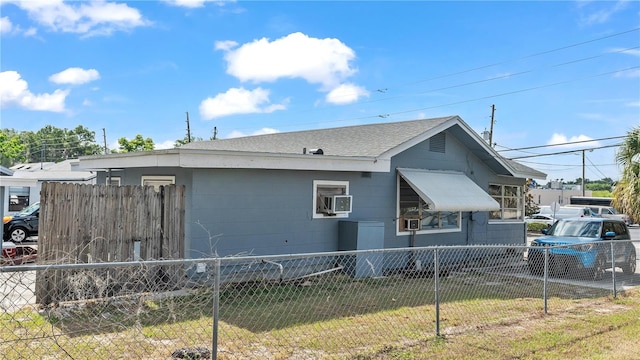 view of side of property featuring a yard