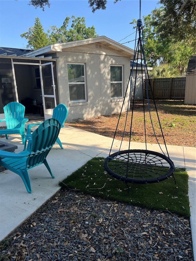 exterior space featuring a patio and a sunroom