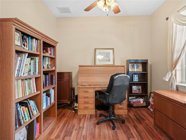 office area with ceiling fan and dark hardwood / wood-style flooring