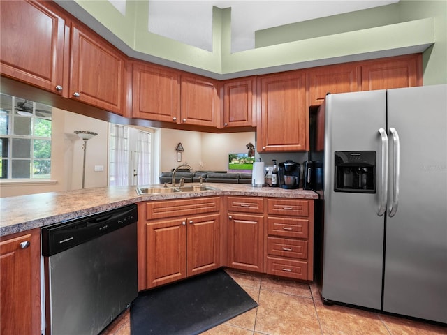 kitchen featuring sink, light tile flooring, and appliances with stainless steel finishes