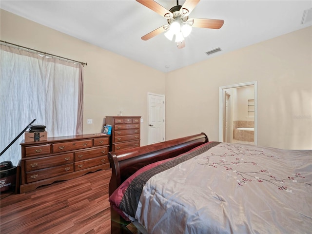 bedroom featuring ceiling fan, ensuite bath, and wood-type flooring