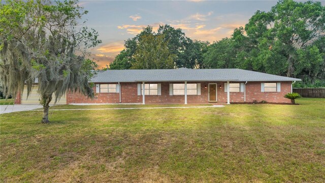 ranch-style house with a lawn