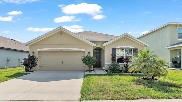 single story home featuring a garage and a front yard