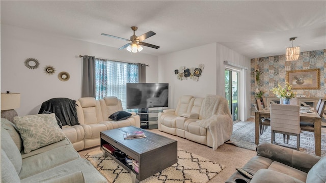 living room with carpet floors and ceiling fan