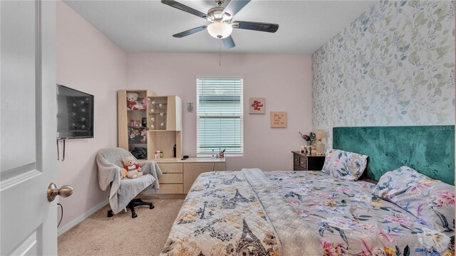 bedroom with ceiling fan and light colored carpet