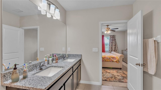 bathroom with tile flooring, ceiling fan, and double vanity