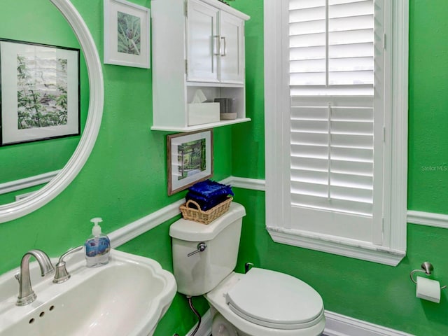 bathroom with sink and toilet