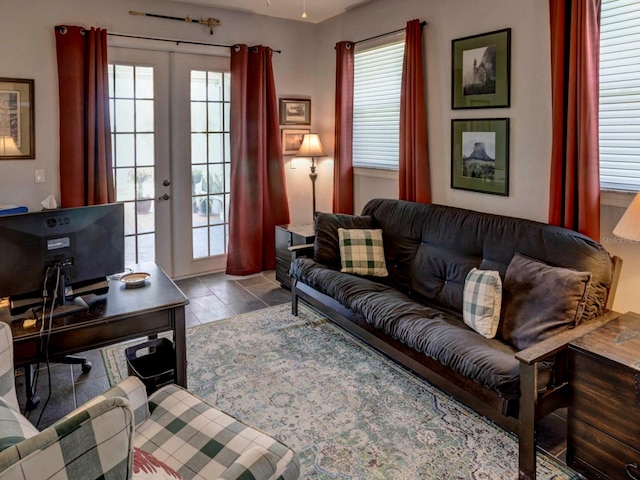 tiled living room featuring french doors