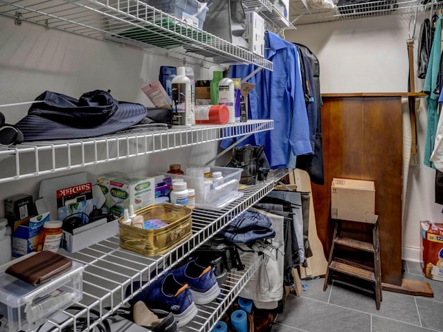 spacious closet with tile floors