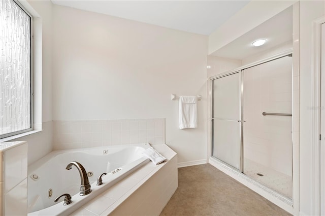 bathroom with separate shower and tub