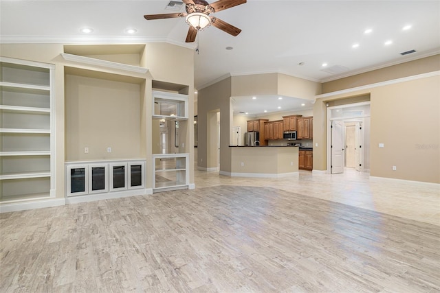 unfurnished living room with ceiling fan, light wood-type flooring, crown molding, and built in shelves