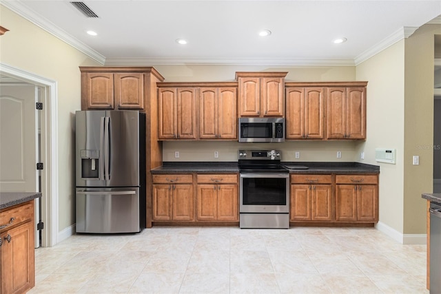 kitchen featuring ornamental molding and stainless steel appliances