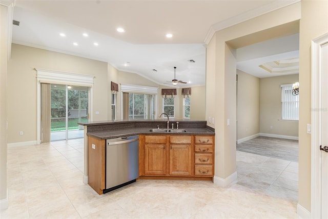 kitchen featuring ceiling fan with notable chandelier, stainless steel dishwasher, plenty of natural light, and sink