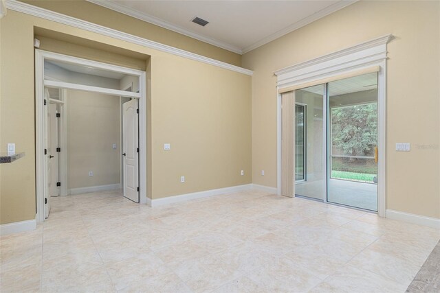 empty room featuring ornamental molding