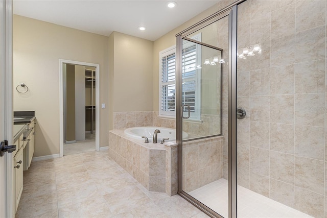 bathroom featuring tile patterned floors, vanity, and independent shower and bath