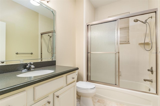 full bathroom with vanity, toilet, and enclosed tub / shower combo