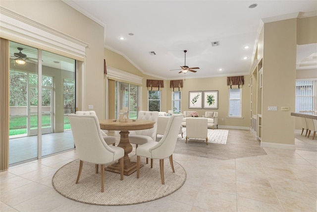 tiled dining space with ceiling fan and ornamental molding