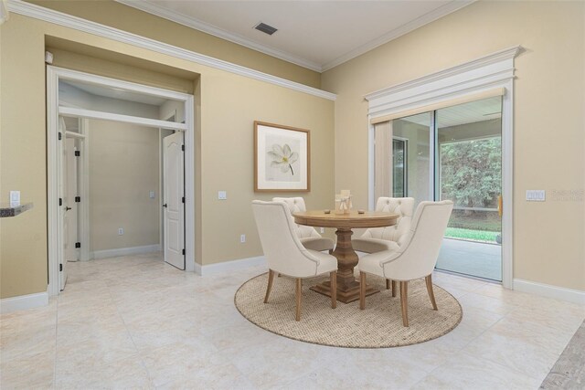 dining area with crown molding