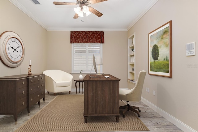 office space featuring ceiling fan, built in features, light hardwood / wood-style flooring, and ornamental molding