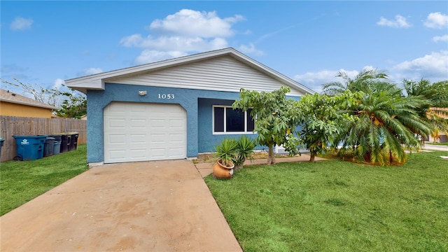 view of front of home featuring a front yard and a garage