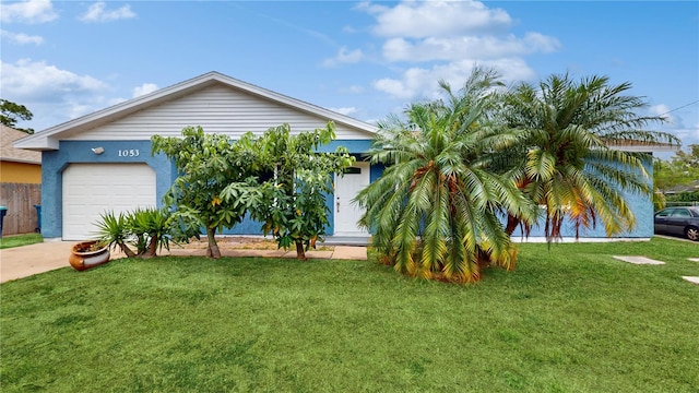 view of front of house with a garage and a front lawn