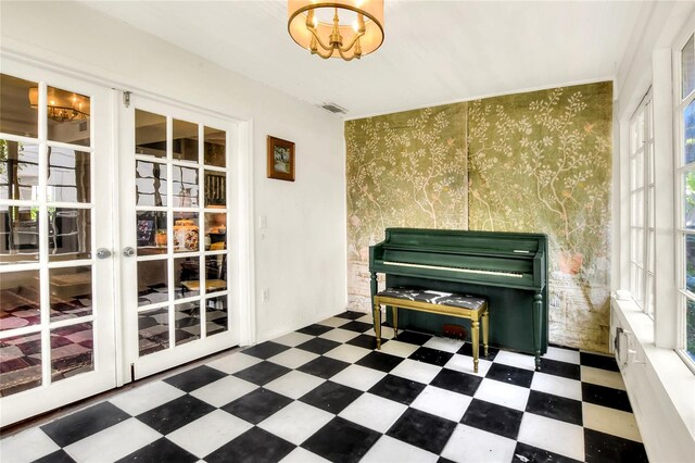 misc room featuring a wealth of natural light, dark tile floors, and french doors