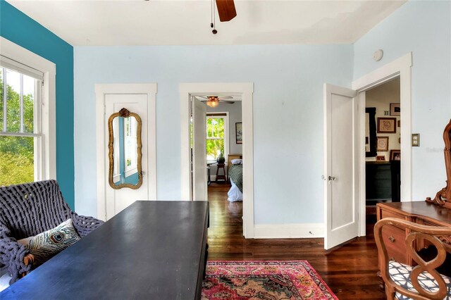 interior space featuring dark hardwood / wood-style flooring and ceiling fan