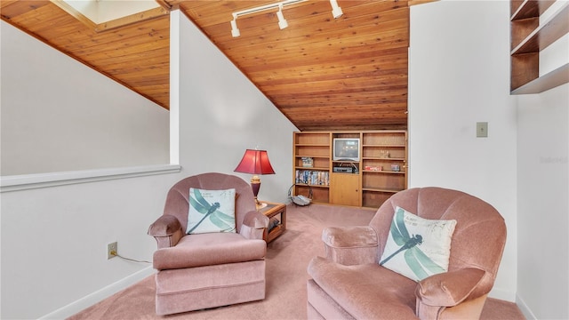 living area featuring wood ceiling, built in shelves, and carpet floors