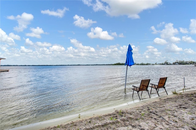 property view of water featuring a boat dock