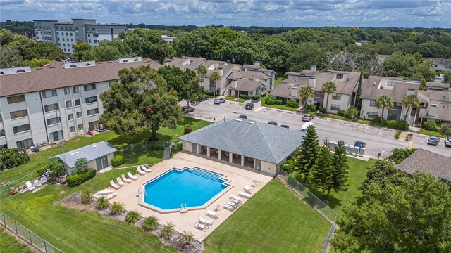 view of swimming pool with a patio and a yard