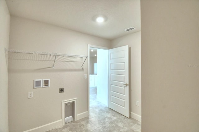 clothes washing area featuring hookup for an electric dryer and washer hookup