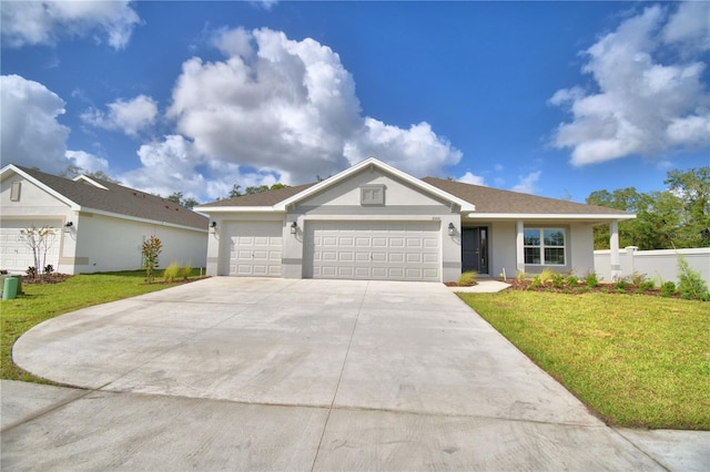 ranch-style home with a front yard and a garage