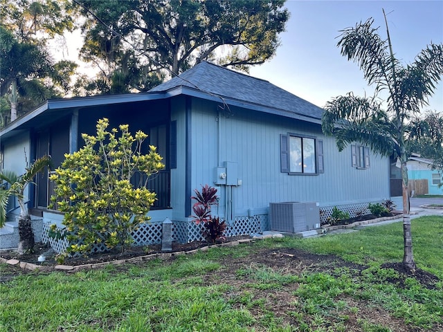 view of side of property with cooling unit