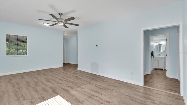 unfurnished room featuring light hardwood / wood-style flooring and ceiling fan